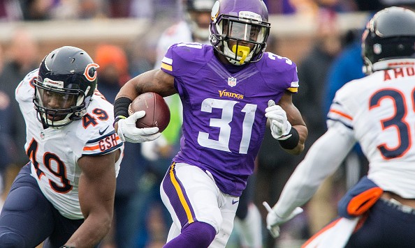 MINNEAPOLIS MN- DECEMBER 20 Jerick Mc Kinnon #31 of the Minnesota Vikings carries the ball during an NFL game against the Chicago Bears at TCF Bank Stadium