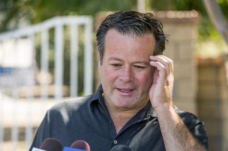 Former NASCAR racer Robby Gordon makes a statement to members of the media gathered outside his home in Orange Calif. on Thursday Sept. 15 2016. Gordon said his family is in shock and grieving the loss of his father and stepmother who were found dead