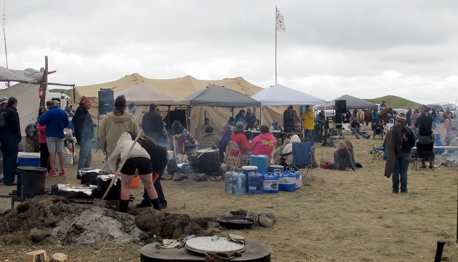 People protesting the construction on a four-state oil pipeline at a site in southern North Dakota gather at campground near the Standing Rock Sioux reservation on Thursday Aug. 25 2016. About 300 people were at the campsite where protesters from across