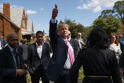 Republican presidential candidate Donald Trump gives a thumbs up during a visit to the childhood home of Dr. Ben Carson Saturday Sept. 3 2016 in Detroit