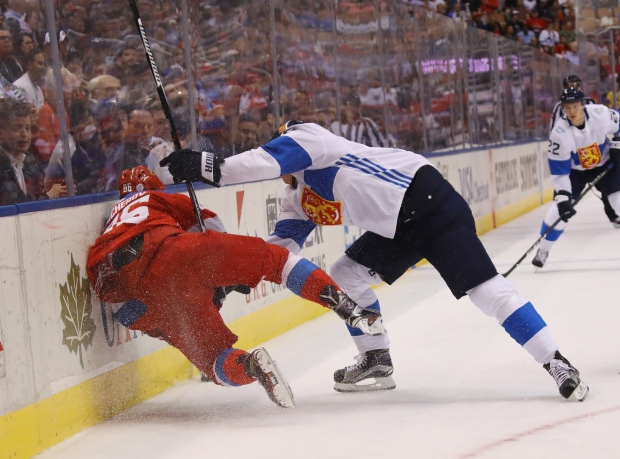 Finland's Jori Lehtera hammers Russia's Nikita Kucherov into the boards