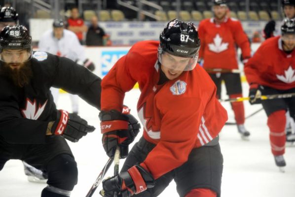 Canada's Sidney Crosby tries to control the puck