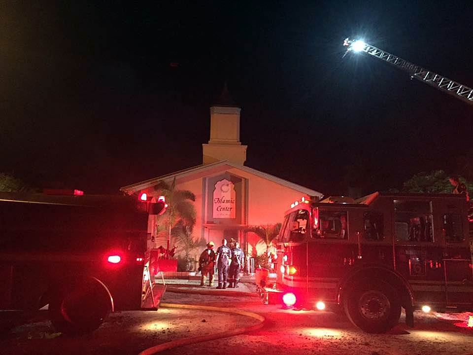 Firefighters work at the scene of a fire at the Islamic Center of Fort Pierce Florida early on Sept. 12. St Lucie Sheriff's Office