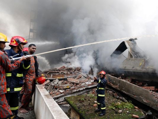 Firefighters work to put out a fire at a packaging factory in Tongi industrial area outside Dhaka Bangladesh Sept. 10 2016