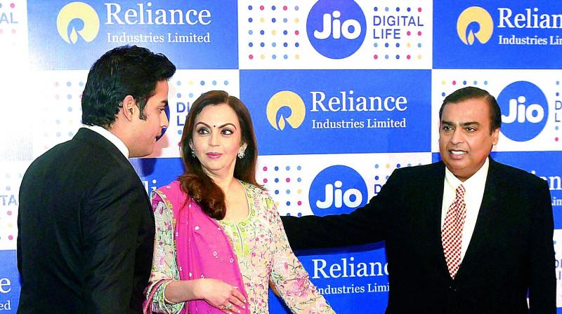 Reliance Industries chairman Mukesh Ambani with his wife Nita Ambani and son Akash Ambani at the company’s annual general meeting on Thursday