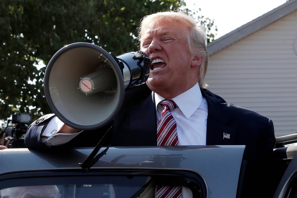 Image Donald Trump speaks to supporters through a bullhorn during a campaign stop at the Canfield County Fair in Canfield Ohio Monday