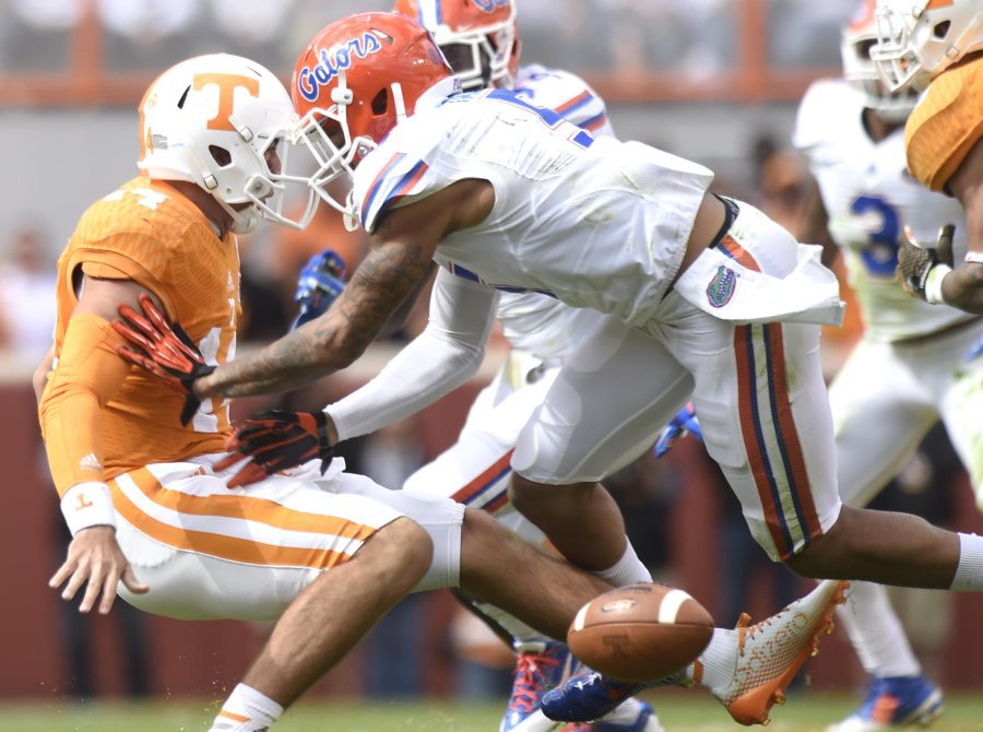 Tennessee quarterback Justin Worley fumbles the ball after being hit by a tackle by Florida defensive back Jalen Tabor during the second half at Neyland Stadium on Saturday Oct. 4 2014 in Knoxville Tenn