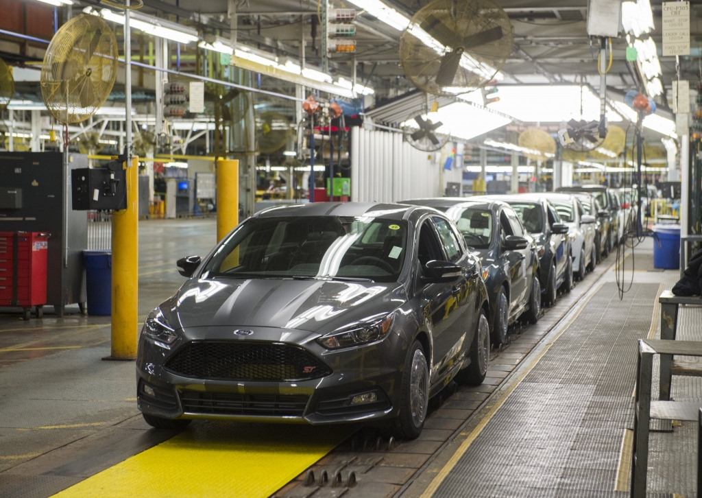 A lineup of Ford Focus vehicles is seen on an assembly line at the Ford Michigan Assembly Plant in Wayne Michigan