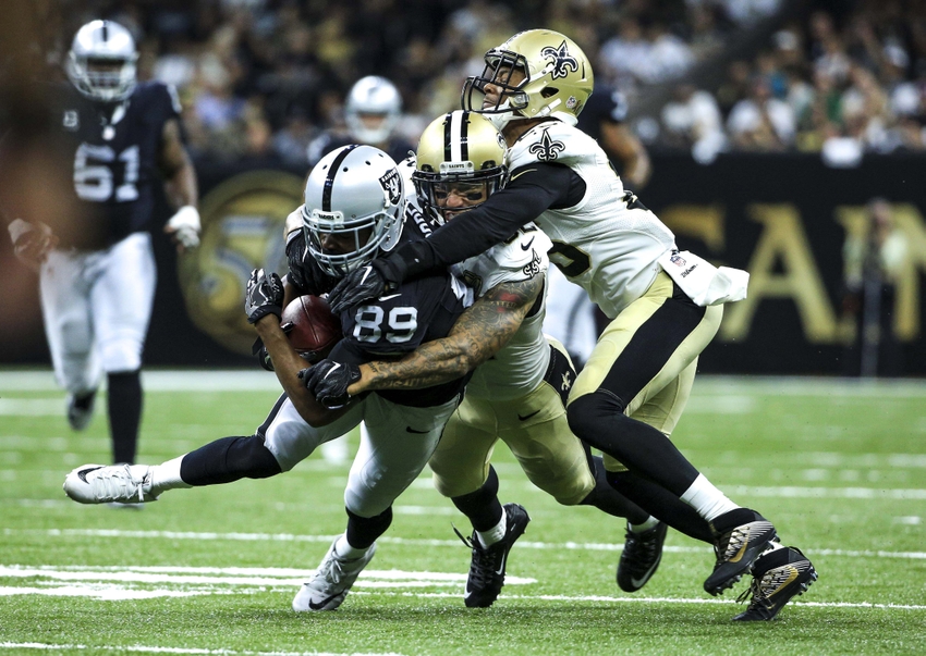 Sep 11 2016 New Orleans LA USA Oakland Raiders wide receiver Amari Cooper is tackled by New Orleans Saints linebacker James Laurinaitis and cornerback P.J. Williams during the second quarter of a game at the Mercedes Benz Superdome. Ma