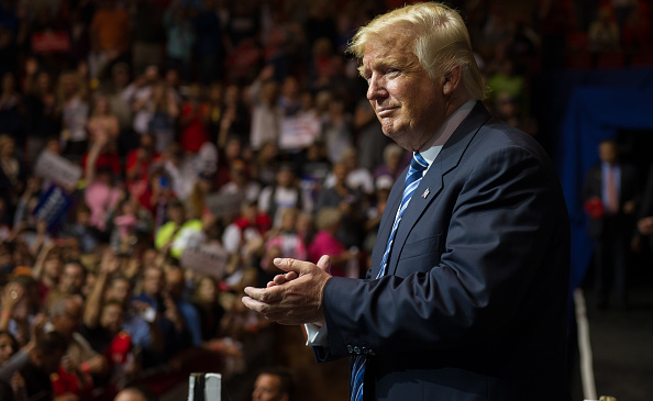 Republican Presidential candidate Donald Trump takes the stage at a campaign rally at the Canton Memorial Civic Center