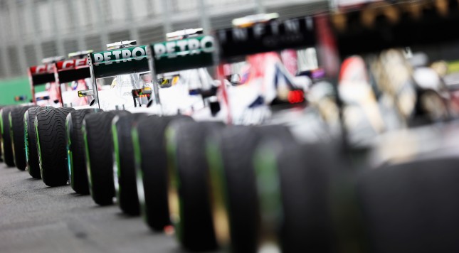 MELBOURNE AUSTRALIA- MARCH 17 Cars sit at the end of the pitlane as the grid waits to restart the weather delayed qualifying session for the Australian Formula One Grand Prix at the Albert Park Circuit