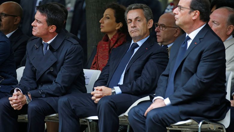 French President Francois Hollande, Prime Minister Manuel Valls and former French President Nicolas Sarkozy attend a ceremony in tribute to victims of terror attacks in Paris France