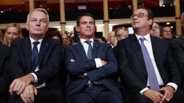 French Prime Minister Manuel Valls centre with French President Francois Hollande right and French Foreign Minister