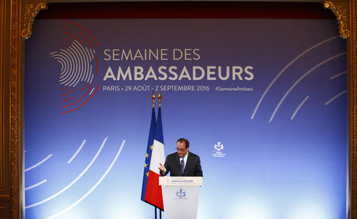 French President Francois Hollande gestures as he addresses French ambassadors Tuesday Aug. 30 2016 in Paris