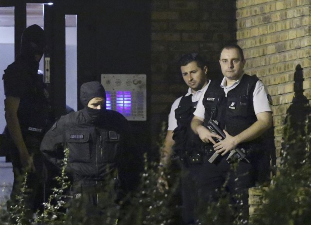 French policemen take part in a police raid in Boussy-Saint-Antoine near Paris France