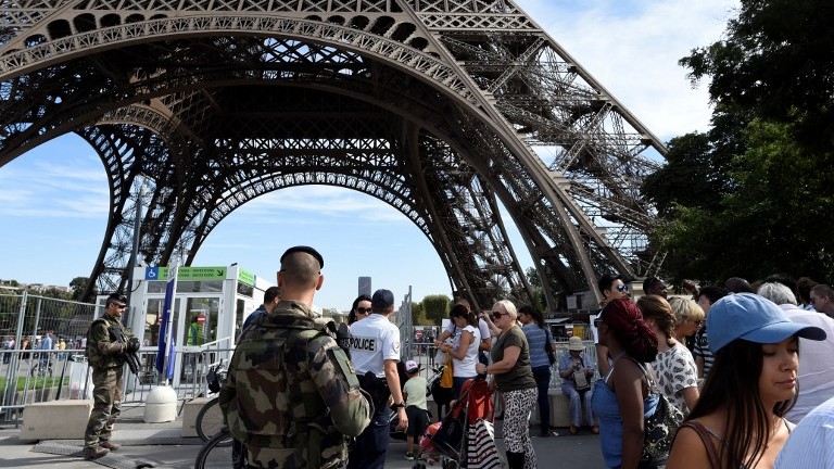 French soldiers patrol around the Eiffel Tower in Paris