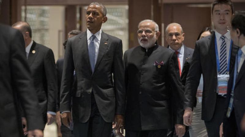 U.S. President Barack Obama left and Indian Prime Minister Narendra Modi arrive for the opening ceremony of the G-20 Summit in Hangzhou