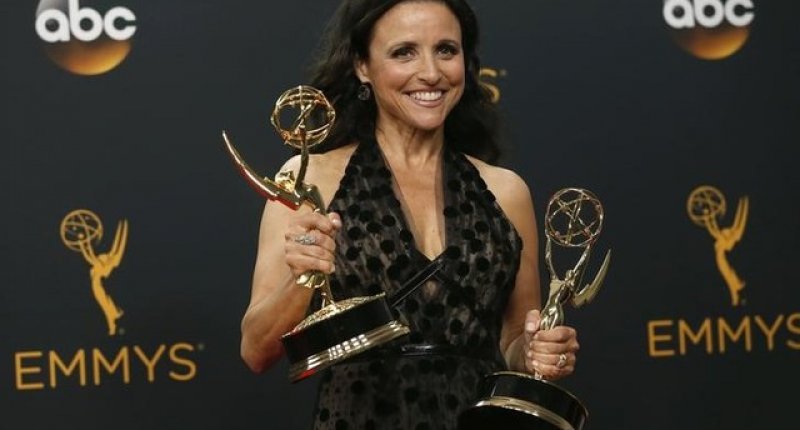 Actress Julia Louis Dreyfus poses backstage with her awards for Outstanding Comedy Series and Outstanding Lead Actress In A Comedy Series for her role in HBO's'Veep at the 68th Primetime Emmy Awards in Los Angeles California U.S