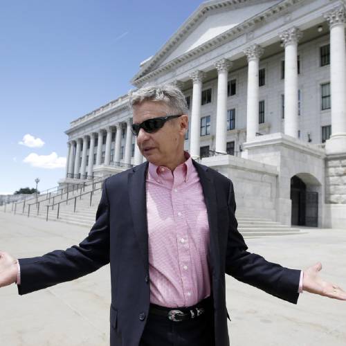 Libertarian presidential candidate former New Mexico Gov. Gary Johnson leaves the Utah State Capitol after meeting with with legislators in Salt Lake City. The day after political heavyweight Mitt Romney