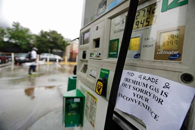 A gas station displays a sign informing customers it is out of certain grades of gasoline in Atlanta Sunday Sept. 18 2016. Colonial Pipeline said it is beginning construction of a temporary pipeline that will bypass a leaking section of its main gasoli