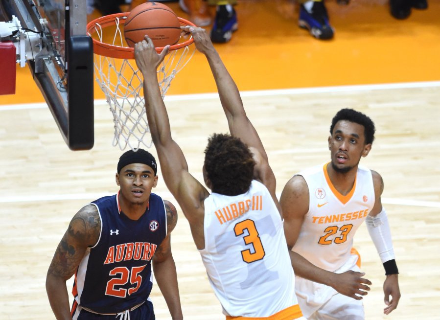 Tennessee guard Robert Hubbs III dunks the ball as Auburn forward Jordon Granger and Auburn guard TJ Lang look on during the second half at Thompson Boling Arena on Tuesday Feb. 9 2016