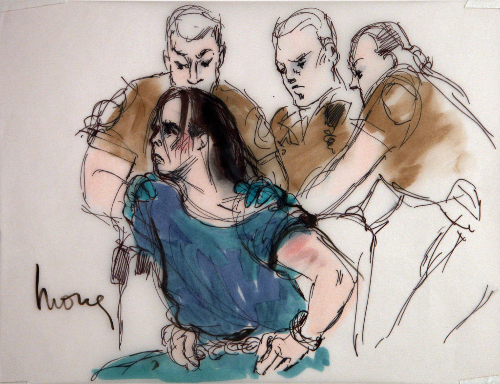 File In this courtroom sketch Harry Burkhart a native of Germany who has been living in Los Angeles and is suspected in a series of arson fires is restrained by guards as he alternately tries to stand and sit during his arraignment in Los Angeles Supe