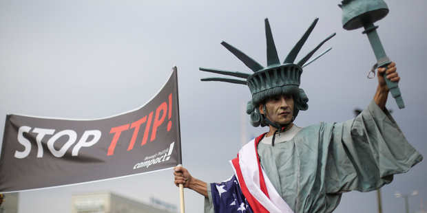 A man attends a demonstration against the planned Transatlantic Trade and Investment Partnership TTIP and the Comprehensive Economic and Trade Agreement CETA in Berlin