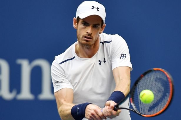 Andy Murray of Great Britain returns a shot to Paolo Lorenzi of Ital