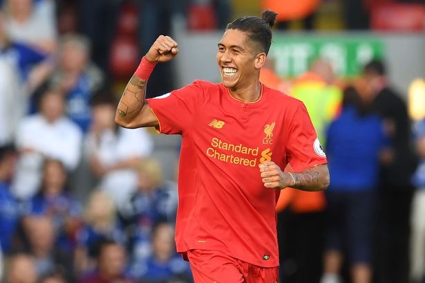 Liverpool's Roberto Firmino celebrates after scoring the opening goal