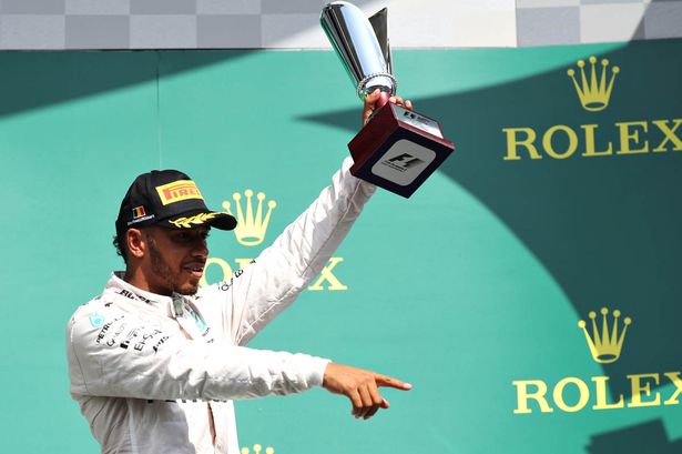 Lewis Hamilton celebrates on the podium