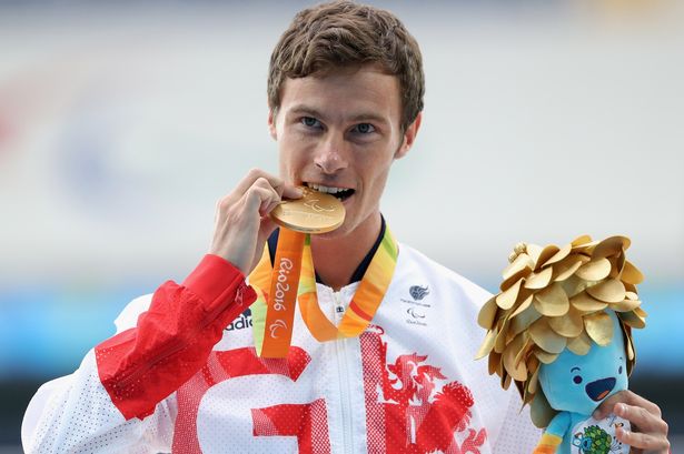 Gold medalist Paul Blake of Great Britain celebrates on the podiuim at the medal ceremony for the Men's 400m- T36 final on day 9 of the Rio 2016 Paralympic Games at the Olympic Stadium