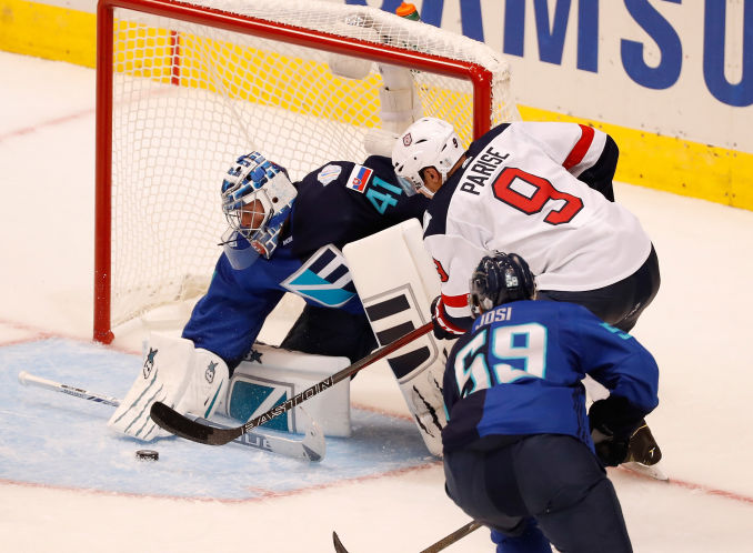 Europe goalie Jaroslav Halak stymies American Zach Parise for one of his 35 saves in a 3-0 shutout in the World Cup opener