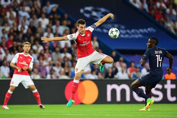 Arsenal's Laurent Koscielny vies with Paris Saint-Germain's Blaise Matuidi