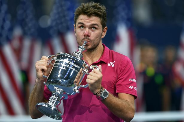 Stan Wawrinka celebrates after defeating Novak Djokovic