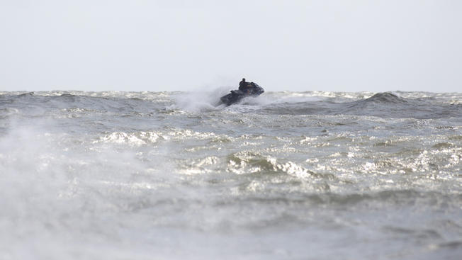 Getty ImagesA man jet skies off the shore of Atlantic City as high winds from tropical storm Hermine impact the coast over Labor Day weekend