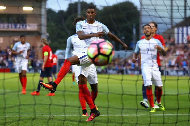 Marcus Rashford celebrates after scoring his hatrick from a penalty