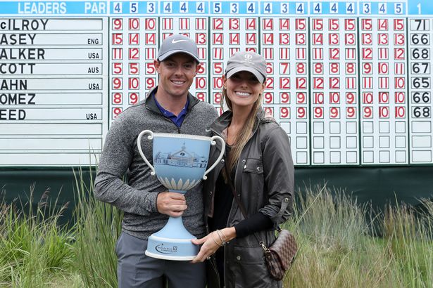 Rory Mc Ilroy with the Deutsche Bank Championship trophy and fiancee Erica Stoll