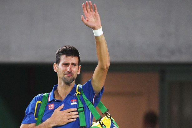 Serbia's Novak Djokovic as he waves to the crowd with tears in his eyes after losing his men's first round singles tennis match against Argentina's Juan Martin Del Potro at the Olympic Tennis Centre of the Rio 2016 Olympic Games