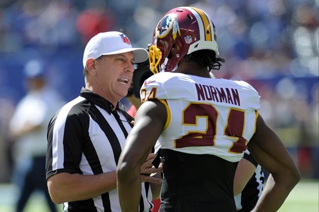 Washington Redskins cornerback Josh Norman talks to officials before an NFL football game against the New York Giants Sunday Sept. 25 2016 in East Rutherford N.J