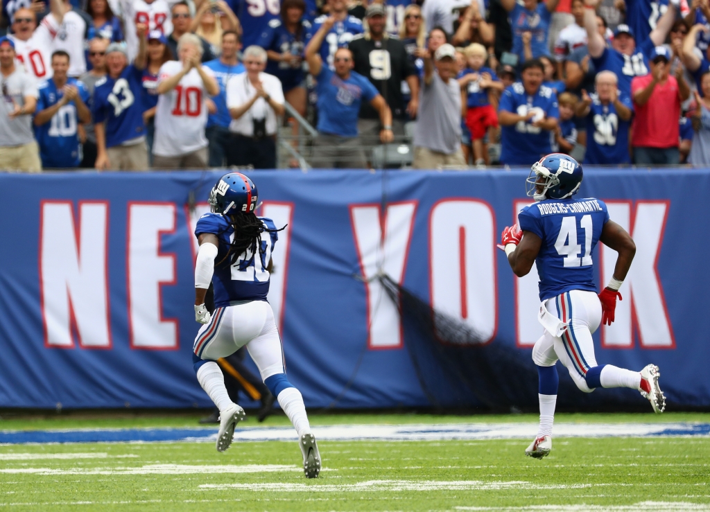 EAST RUTHERFORD NJ- SEPTEMBER 18 Janoris Jenkins #20 of the New York Giants runs in a 65-yard touchdown during second quarter against the New Orleans Saints at Met Life Stadium