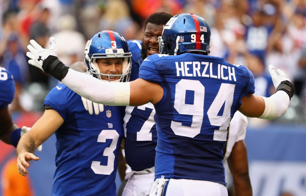 EAST RUTHERFORD NJ- SEPTEMBER 18 Kicker Josh Brown #3 of the New York Giants celebrates kicking the game-winning field goal against the New Orleans Saints in the fourth quarter at Met Life Stadium