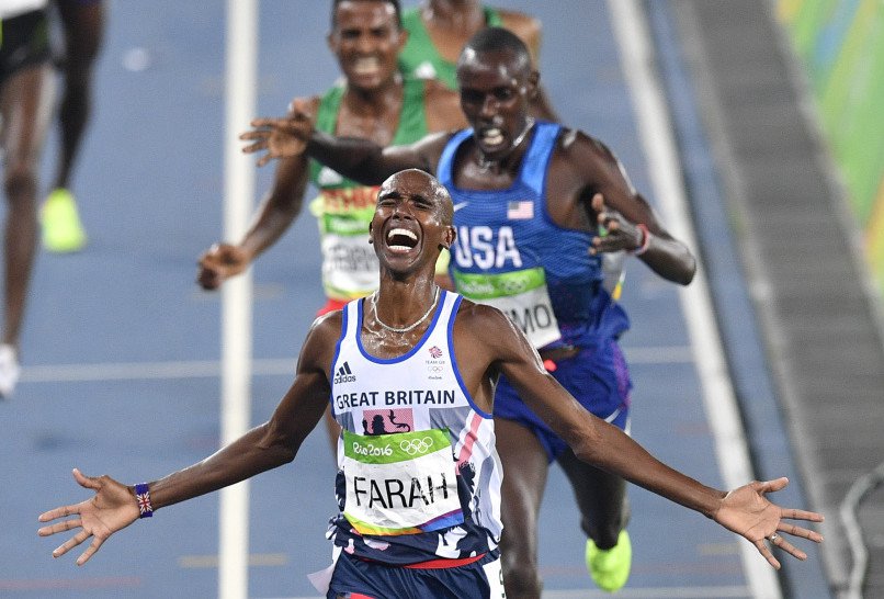 Britain's Mo Farah wins the gold medal in the men's 5,000 meters finishing just ahead of surprise silver medalist Paul Chelimo of the United States