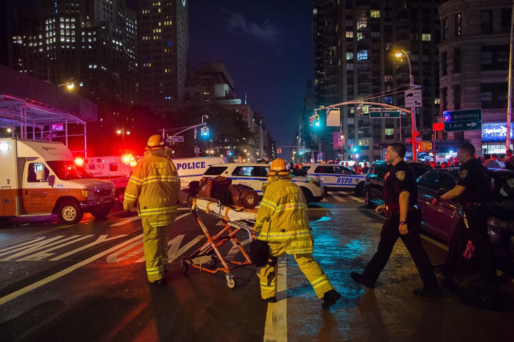 Police and firefighters work near the scene of an apparent explosion in Manhattan's Chelsea neighborhood in New York Saturday Sept. 17 2016. A law enforcement official tells The Associated Press that an explosion in the Chelsea neighborhood appea