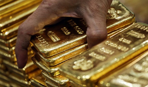 Gold futures for December delivery advanced 1 per cent to settle at $US1344.70 an ounce at 1.50pm on the Comex in New