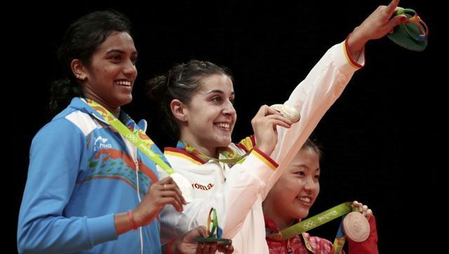 Gold medallist Carolina Marin of Spain, silver medallist PV Sindhu of India and bronze medallist Nozomi Okuhara of Japan pose together