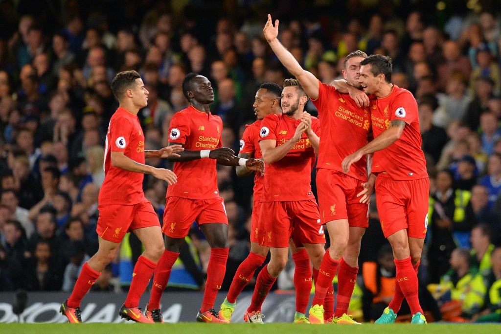 Liverpool's English midfielder Jordan Henderson celebrates with Liverpool's Croatian defender Dejan Lovren after scoring his team's second goal during the English Premier League football match between Chelsea and Liverpool at Stamford Bridge in L