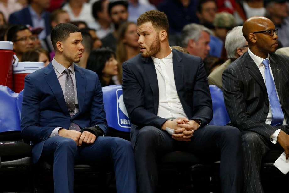 Injured Los Angeles Clippers guard Austin Rivers left and forward Blake Griffin talk on the bench during a game against the San Antonio Spurs at Staples Center in Los Angeles on Thursday Feb. 18 2016