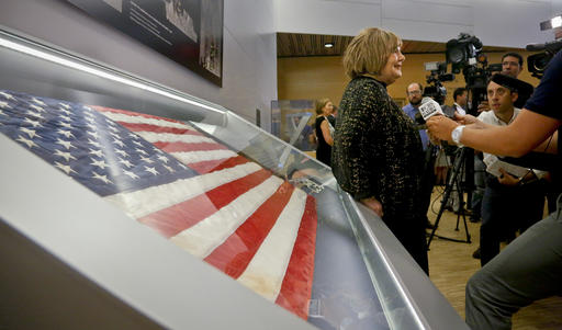 Shirley Dreifus center the original owner of the American flag left that firefighters hoisted at ground zero in the hours after the 9/11 terror attacks hold interviews at the Sept. 11 museum Thursday Sept. 8 2016 in New York. After disappearing