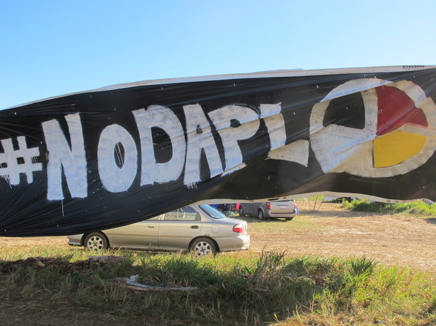 A banner protesting the Dakota Access oil pipeline is displayed at an encampment near North Dakota's Standing Rock Sioux reservation on Friday Sept. 9 2016