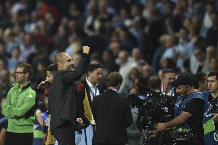 Manchester City's Spanish manager Pep Guardiola turns to wave into the crowd during the UEFA Champions League group C football match between Manchester City and Borussia Monchengladbach at the Etihad stadium in Manchester northwest England on September